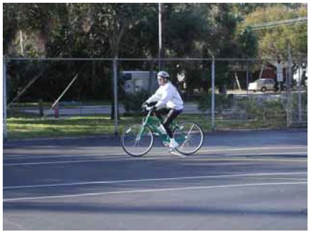 Figure 32: Photo. A participant traveling through the largest radius path. A participant on a bicycle is riding through the turning path with the largest radius.