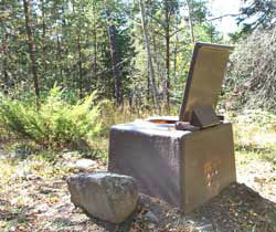 Photo of a pit toilet in the wilderness