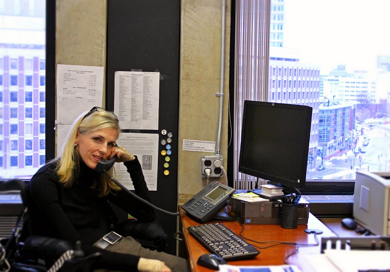 ADA Coordinator in office on the phone