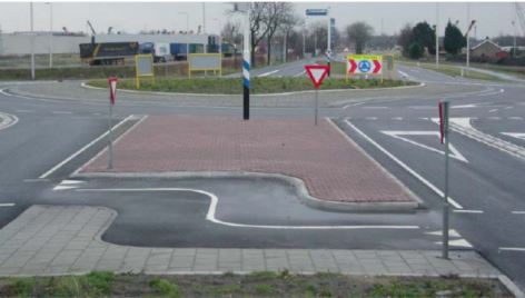 bicycle path that changes direction to the right in a splitter island at a turbo-roundabout