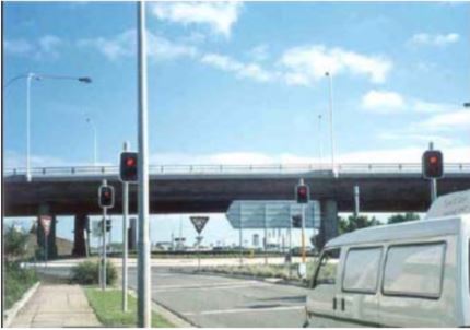 photo of a signalized roundabout crosswalk