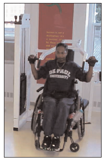 man in wheelchair using an accessible weight training machine