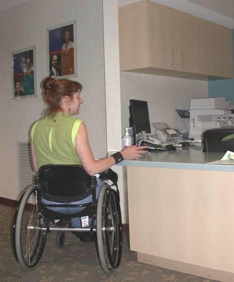 Image showing a person in a wheelchair at an accessible reception desk