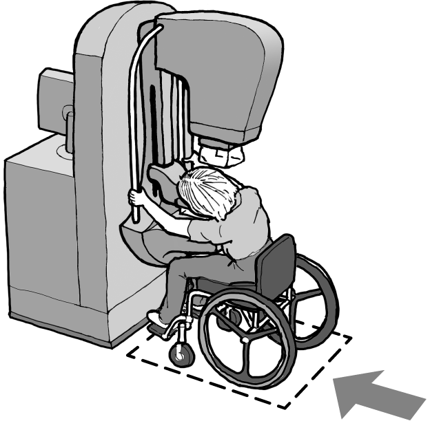 Woman using a manual wheelchair holding onto the supports of the mammography machine shown in the overview. The machine is adjusted to a lower height to accommodate a seated position.