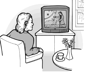 A woman who is deaf reads a captioned evacuation notice on her television.