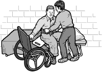 A shelter worker helps a man transfer onto a cot.