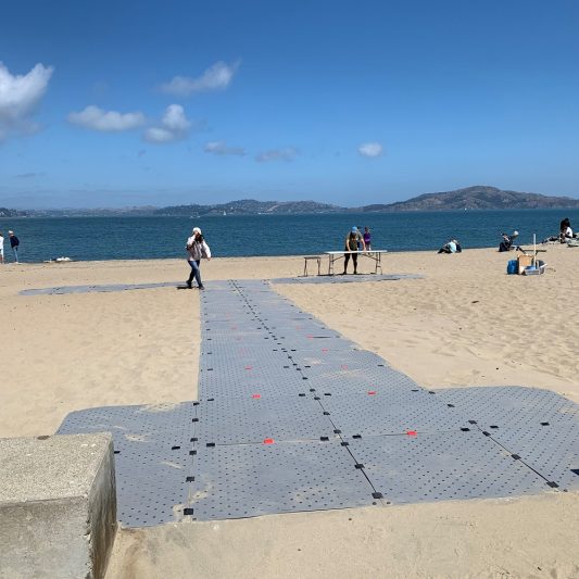 Access Trax's accessible mats installed as a double-wide beach pathway for ADA compliance.
