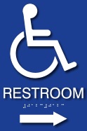 Raised letter and braille "Restroom" sign with ISA and directional arrow