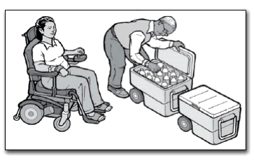 A woman in a power wheelchair watches a man get a drink out of a cooler.