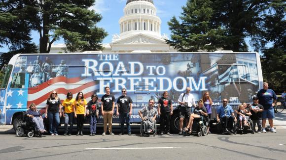 Participants in front of Tour Bus that promotes the ADA Legacy Tour
