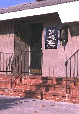 shows an entrance to a restaurant with three steps