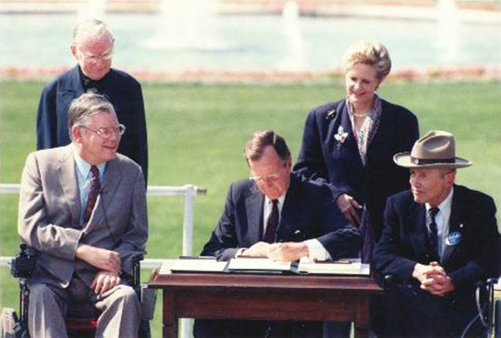 Photo of President George Bush signing in the ADA