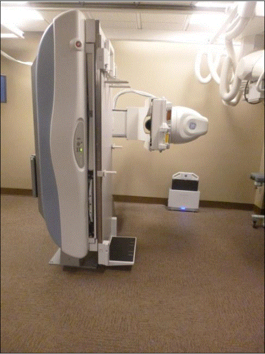 This pictures show an Angulating Radiographic and Fluoroscopic Exam Table whose fixed height is approximately 34.5 inches. The table surface is also able to move in two directions horizontally. 