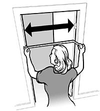 woman measures width of door with tape measure