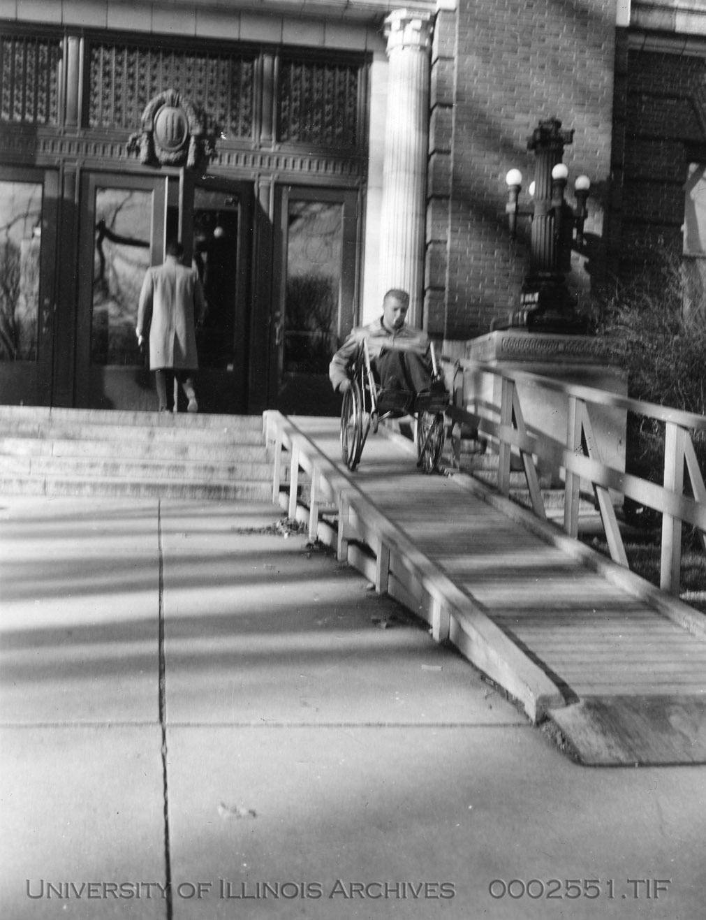 A wooden wheelchair ramp, 1952. The University of Illinois was the first university to provide wheelchair access for disabled World War II veterans.