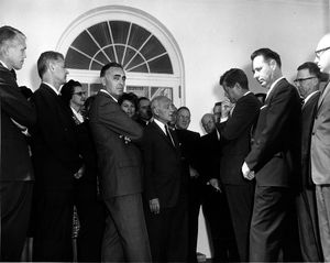 A 1961 photo showing JFK visiting at the White House with members of the President's Panel on Mental Retardation.