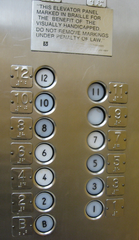 Elevator with braille signage.