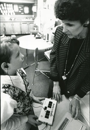 A student with visual impairment and her teacher, c. 1970s.