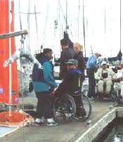 photo of man in wheelchair on finger pier