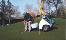 photo of player putting from single rider adaptive cart