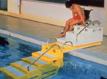 photo of individual entering pool using transfer steps