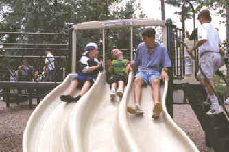 photo of children on a straight slide