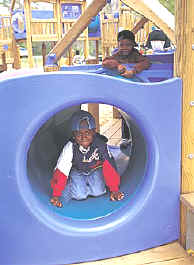 photo of children using a tunnel play space